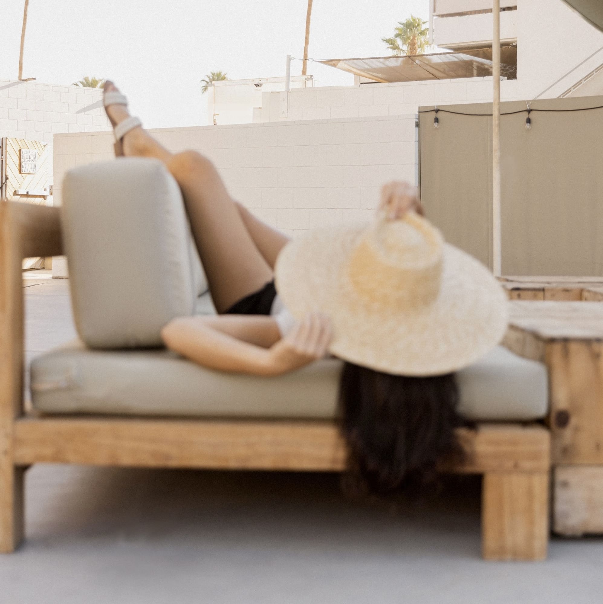 Hairstylist mentor relaxing on a couch, blog about making more money in the beauty industry